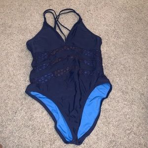 Blue strappy one piece bathing suit